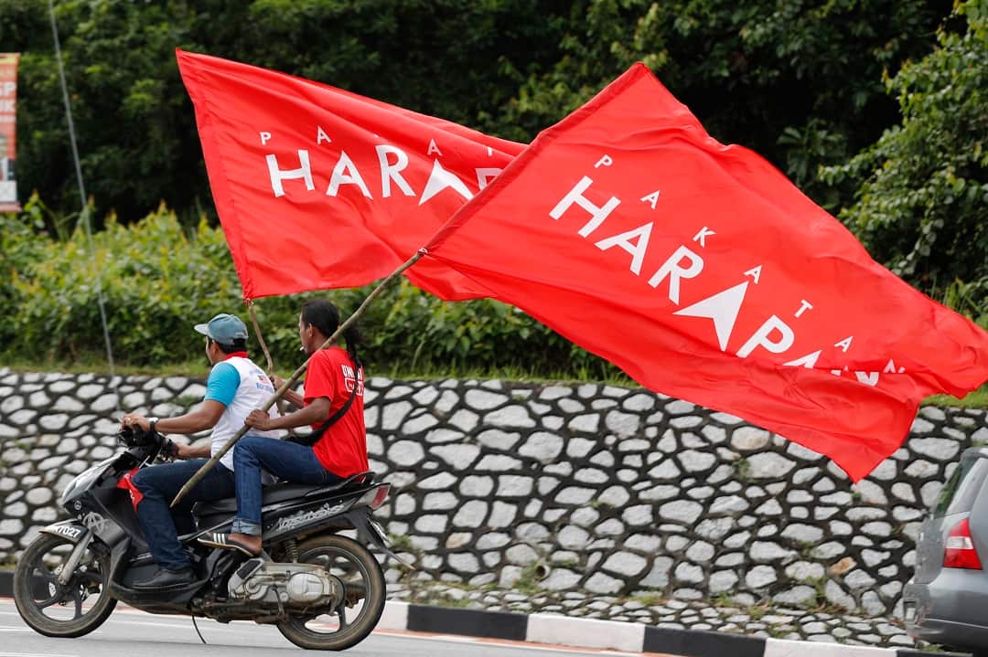 Supporters rides with flags of Pakatan Harapan (Alliance of Hope).