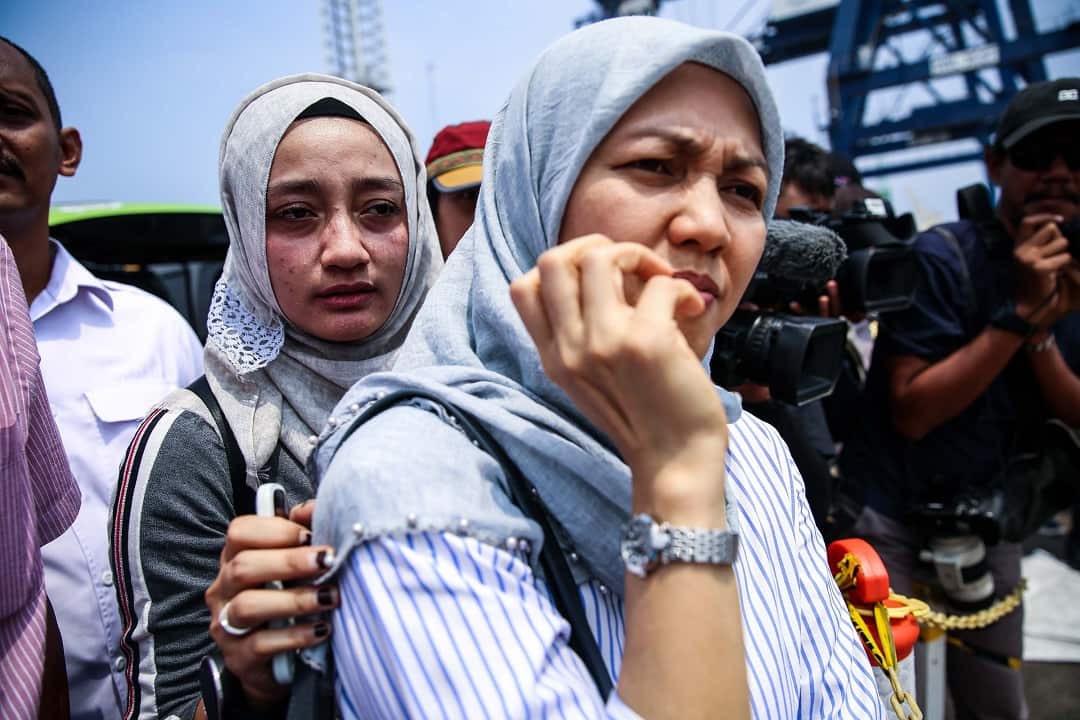 Families of the victims of Lion Air flight JT610, visit an operations centre to look for personal items of their relatives.