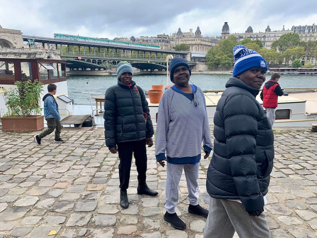 Janet Marawarr (middle) in Paris with other artists from the Babbarra Women's Centre.