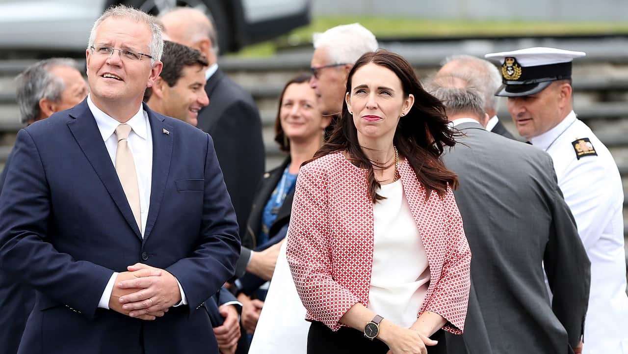 Scott Morrison and Jacinda Ardern look at the cenotaph as they walk towards the wreath laying ceremony at the War Memorial Museum in Auckland.