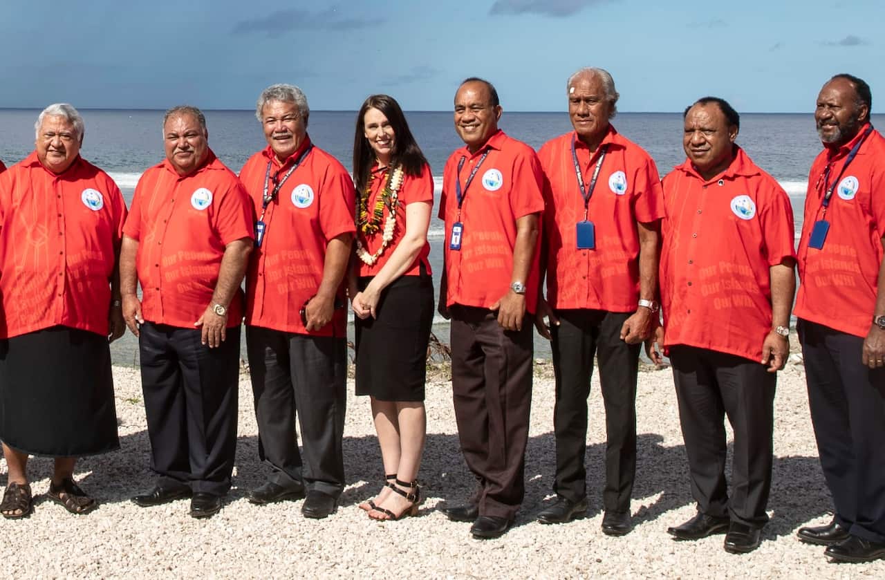 Nauru President Baron Waqa, second from left, poses with New Zealand Prime Minister Jacinda Ardern, fourth from left and other Pacific leaders for a group photo during the Pacific Islands Forum