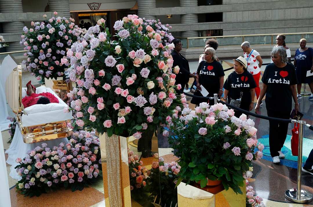 Aretha Franklin's coffin lies at Charles H. Wright Museum of African American History during a public visitation in Detroit, Tuesday, Aug. 28, 2018. Franklin died Aug. 16, of pancreatic cancer at the age of 76. (AP Photo/Paul Sancya, Pool)