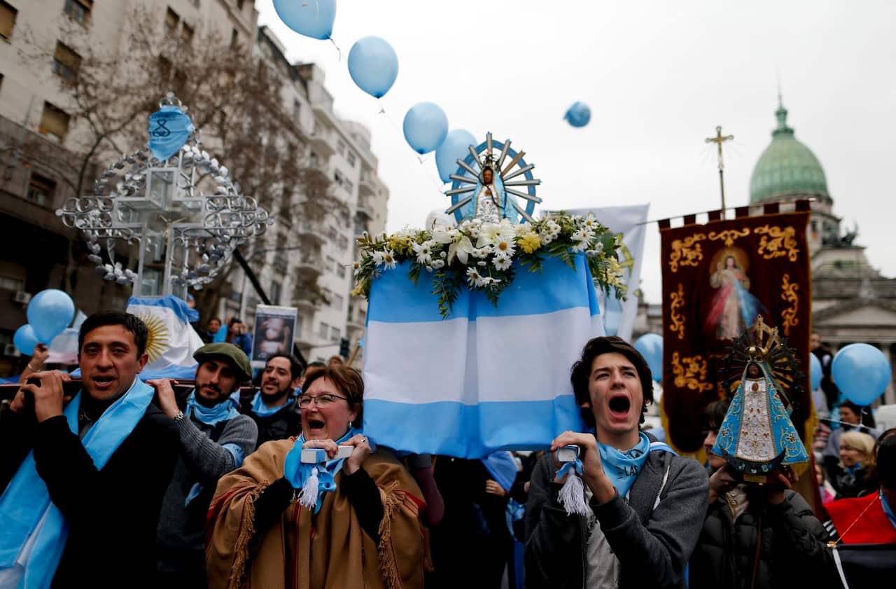 Demonstrators against the decriminalization of abortion gather outside Congress in Buenos Aires, Argentina Wednesday, Aug. 8, 2018. 