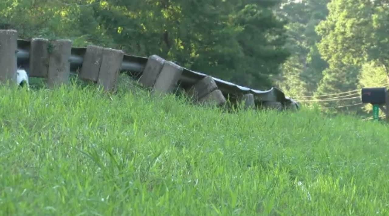 The railings on the side of the road were damaged in the incident (image via CNN)