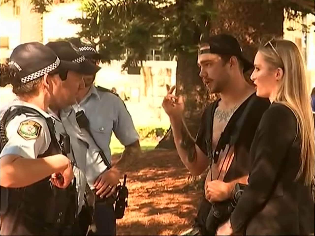 Police speak with the pair after the alleged incident. 