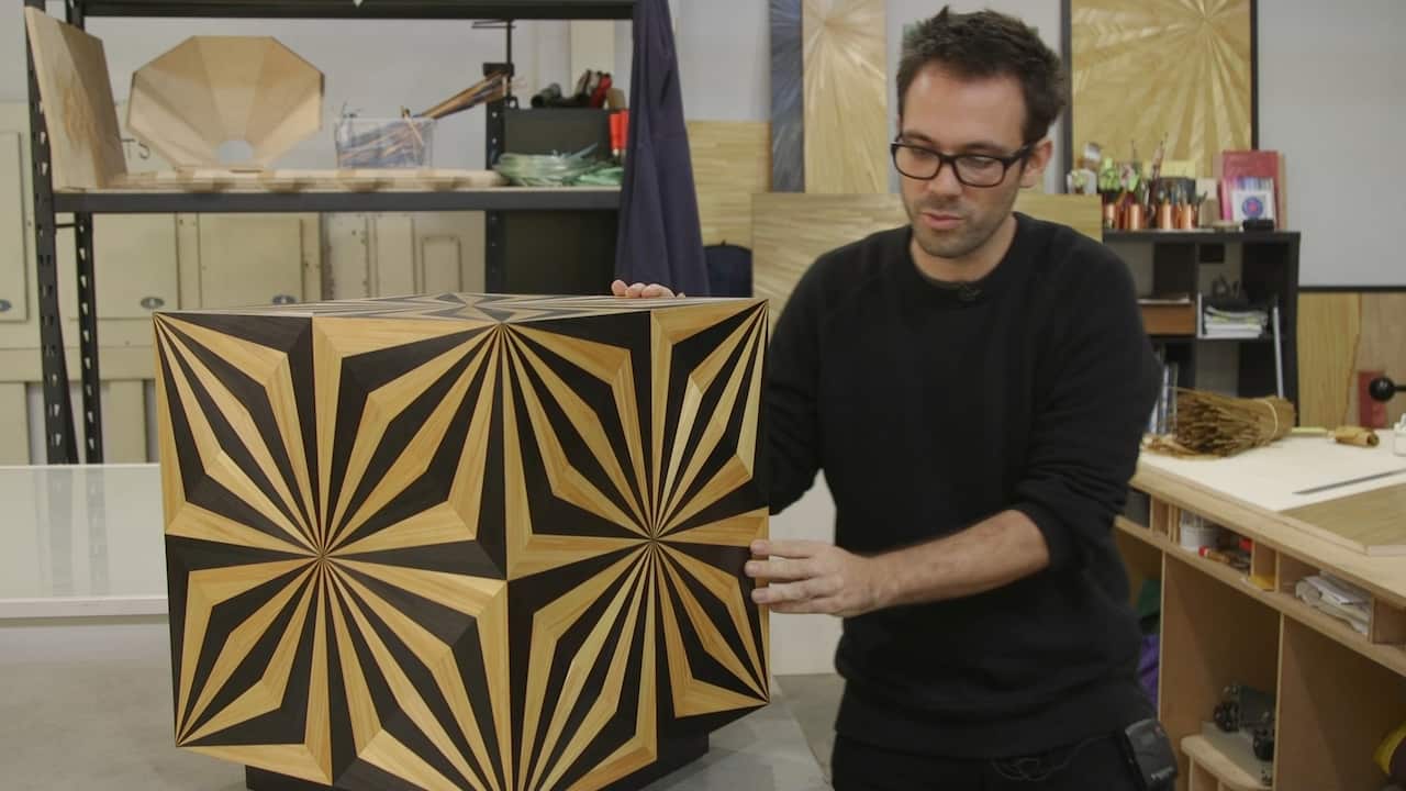 Arthur Seigneur with his straw marquetry art