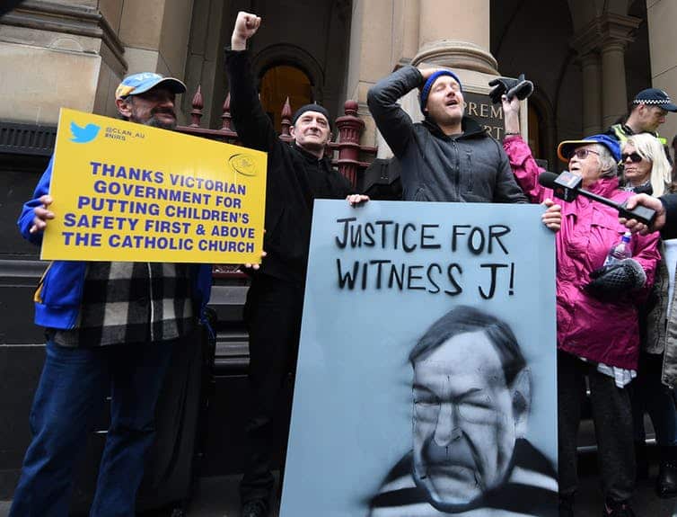 Supporters of abuse victims outside the Victoria Supreme Court building in August. Today’s decision was handed down in a near-empty High Court building.  
