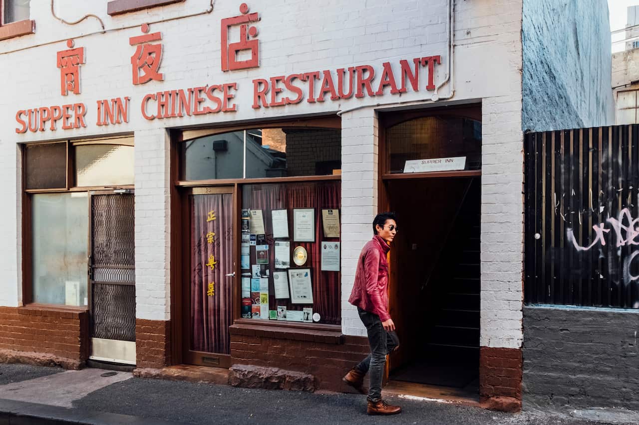 Chris Pang, who appeared in Crazy Rich Asians, enters the Supper Inn Chinese Restaurant in Melbourne, Australia.