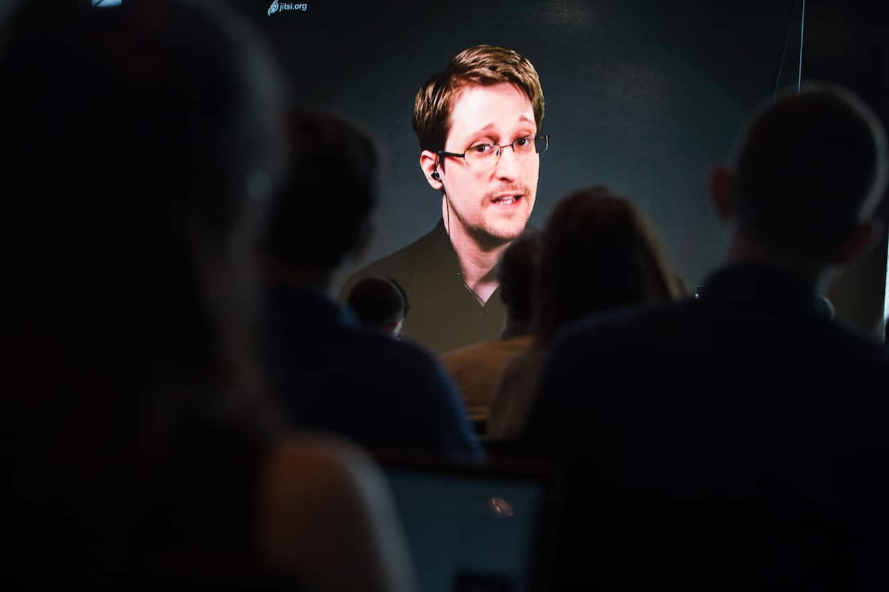 Edward Snowden speaks via video remote at a research conference at the MIT Media Lab.