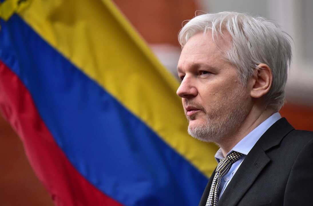 WikiLeaks founder Julian Assange with a Colombian flag in the background
