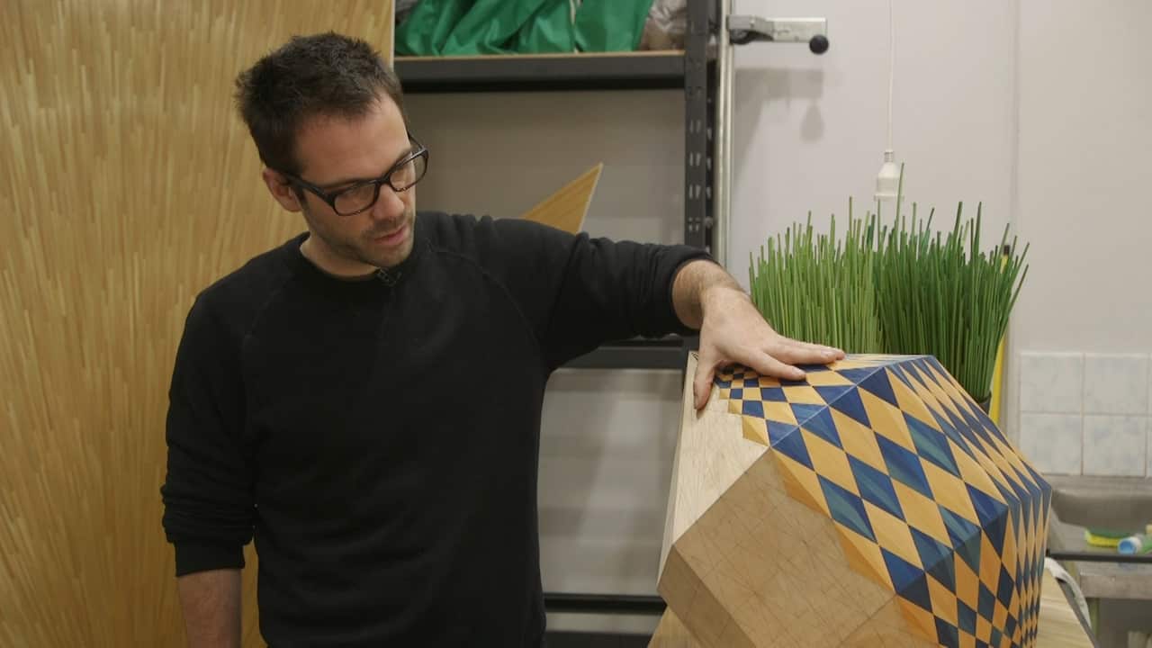 Arthur Seigneur with his straw marquetry art