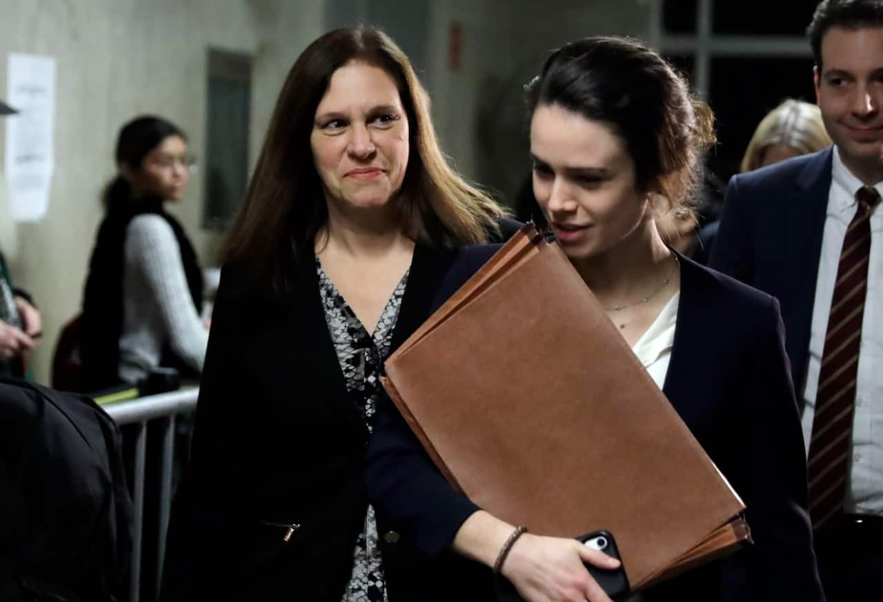 Assistant District Attorney Joan Illuzzi, left, leaves the courtroom of the Harvey Weinstein rape trial 