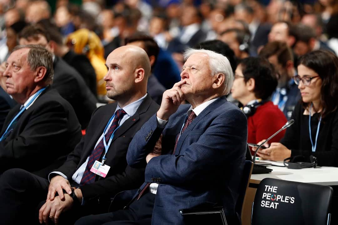Sir Richard Attenborough listens to a speech during the COP24 United Nations Climate Change Conference in Katowice, Poland, Monday, Dec. 3, 2018. (Peter Klaunzer/Keystone via AP)