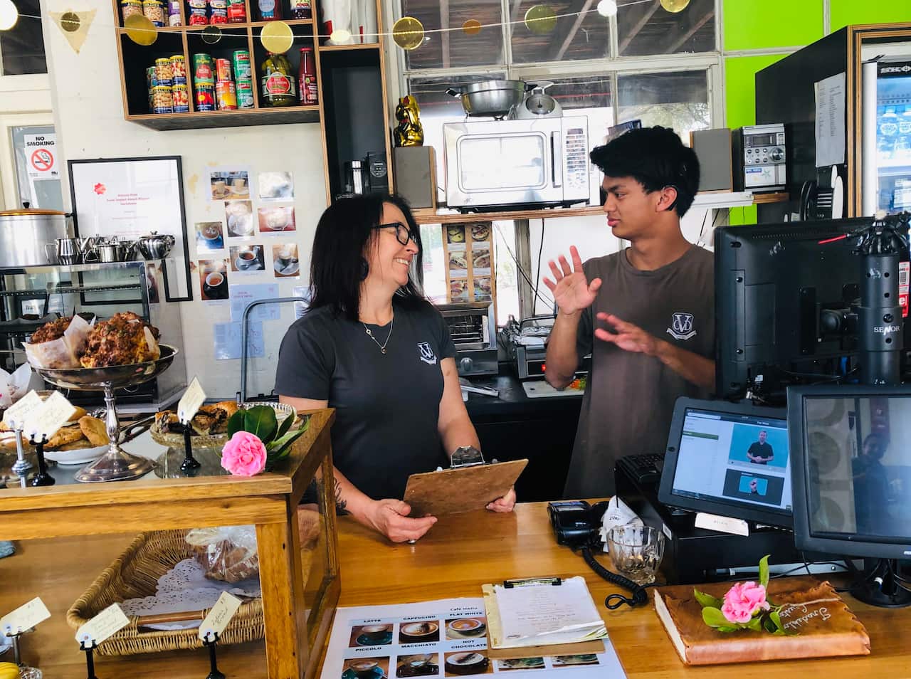 Rafael and Acting Assistant Principal Amanda Joyce work together at the cafe.