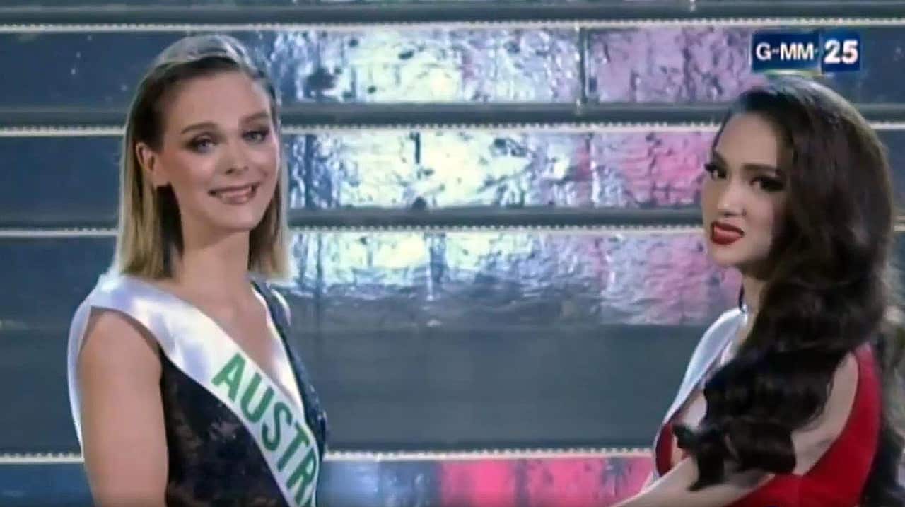 Australia's Jacqueline and Vietnam's Nguyen Huong Giang await for the winner to be announced.