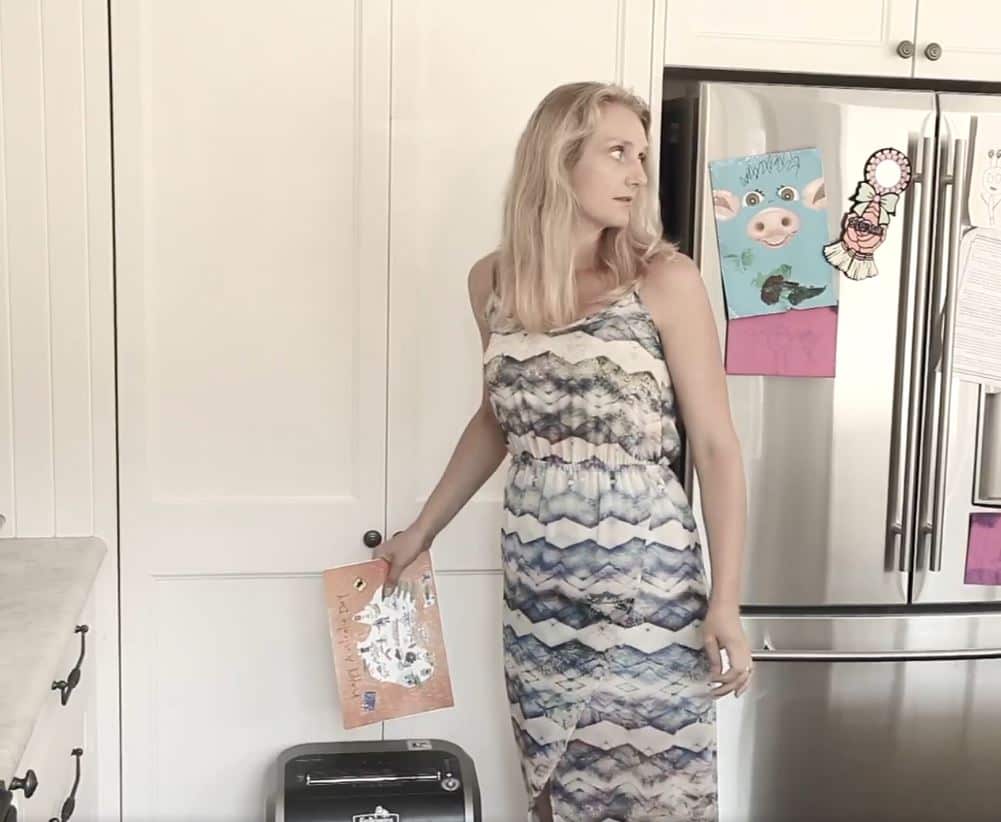 The girl's mother is then seen shredding the card.