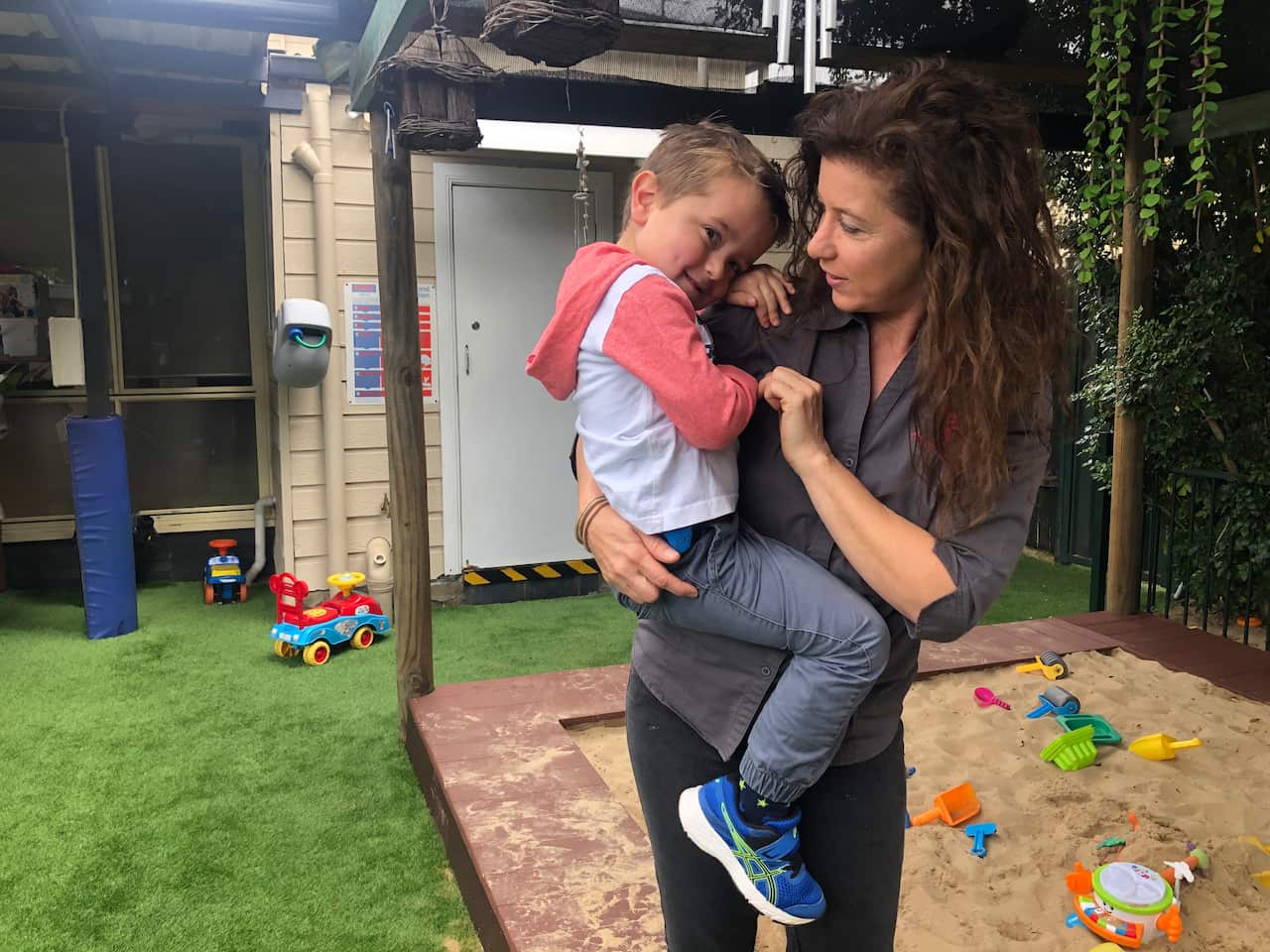 Averil Flint holds her youngest son. 