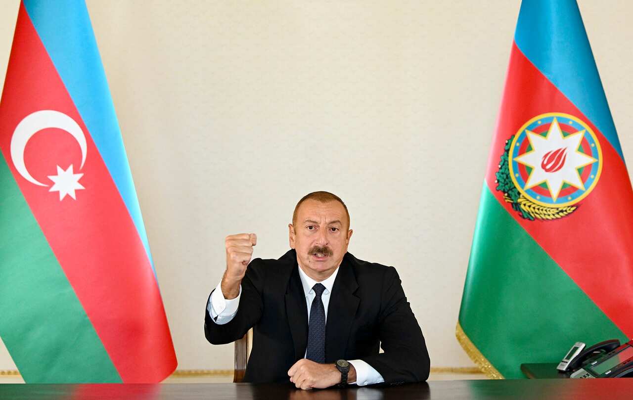 Azerbaijani President Ilham Aliyev gestures as he addresses the nation in Baku, Azerbaijan. 