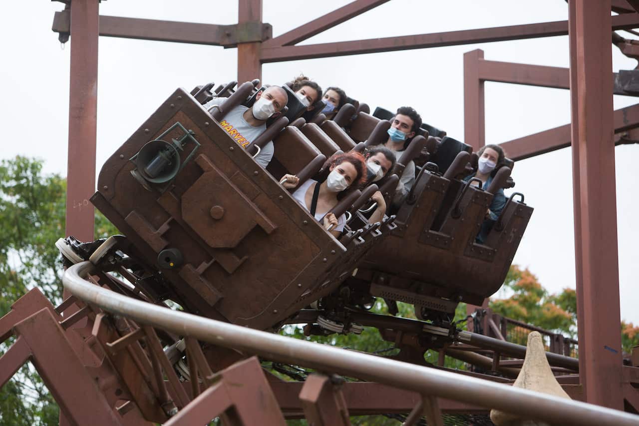 People wearing face mask on roller coaster at Disneyland Paris as the theme park reopens its doors to the public in Marne-la-Vallee, near Paris, following the coronavirus disease (COVID-19) outbreak in France, July 16, 2020. Photo by Raphael Lafargue/ABAC