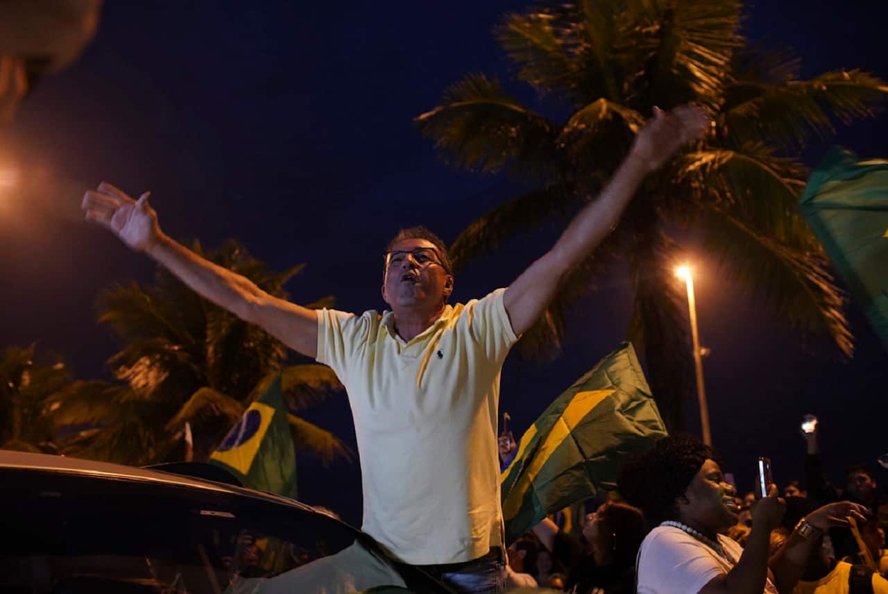 A supporter of Jair Bolsonaro, presidential candidate with the Social Liberal Party, celebrates. 