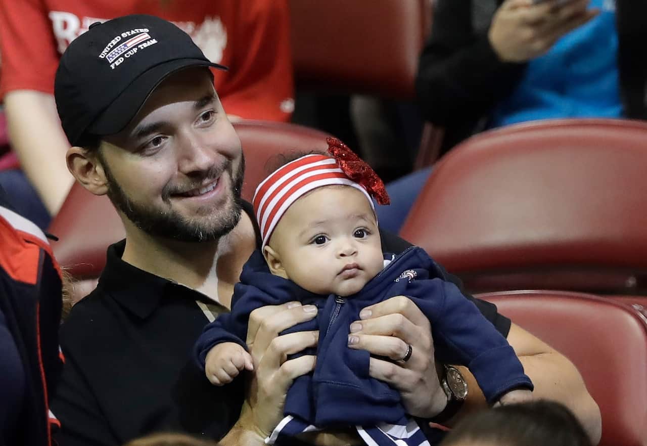 Alexis Ohanian, husband of USA's Serena Williams, holds their baby, Alexis Olympia Ohanian Jr.