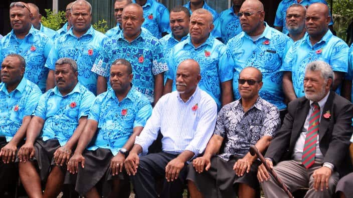 Fiji minister for employment Jone Usamate with men hired by Paladin to work on Manus in Suva.