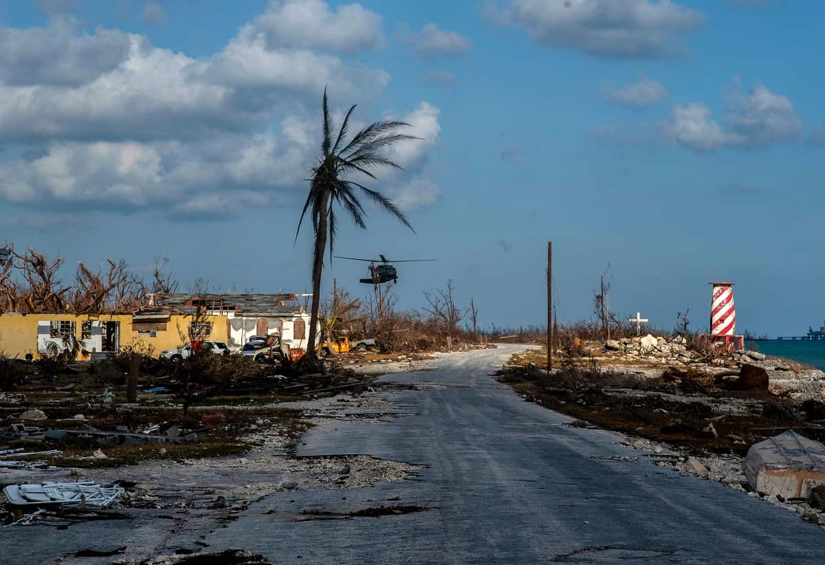 A helicopter flies over the village of High Rock after delivering emergency supplies in the aftermath of Hurricane Dorian In High Rock, Grand Bahama.