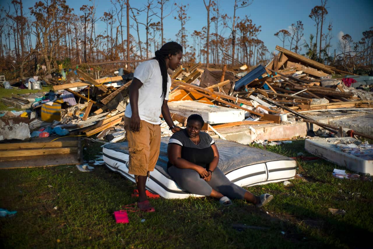 Survivors collect belongings in the wake of the fierce hurricane.