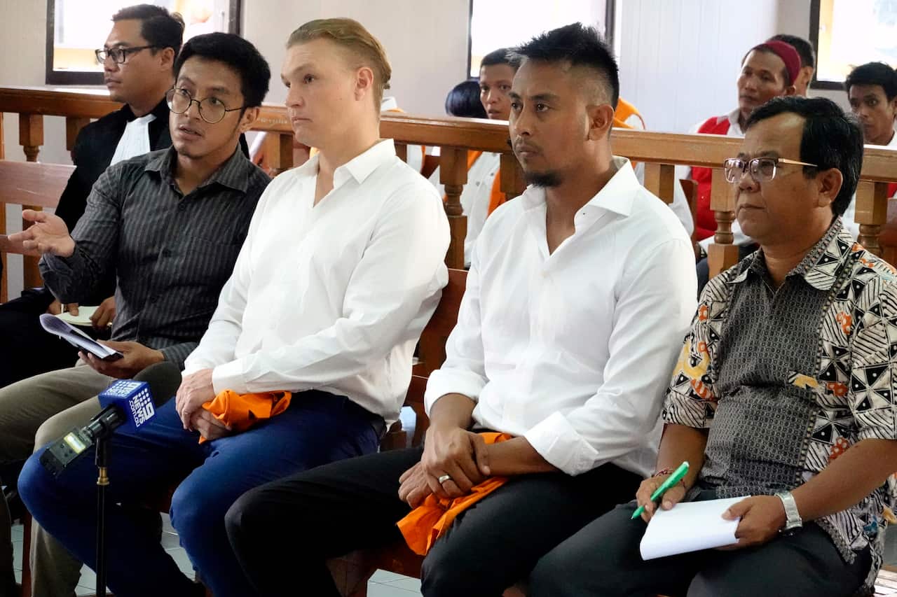 David Van Iersel (2L) and William Cabantog (2R) inside the courtroom during their trial. 