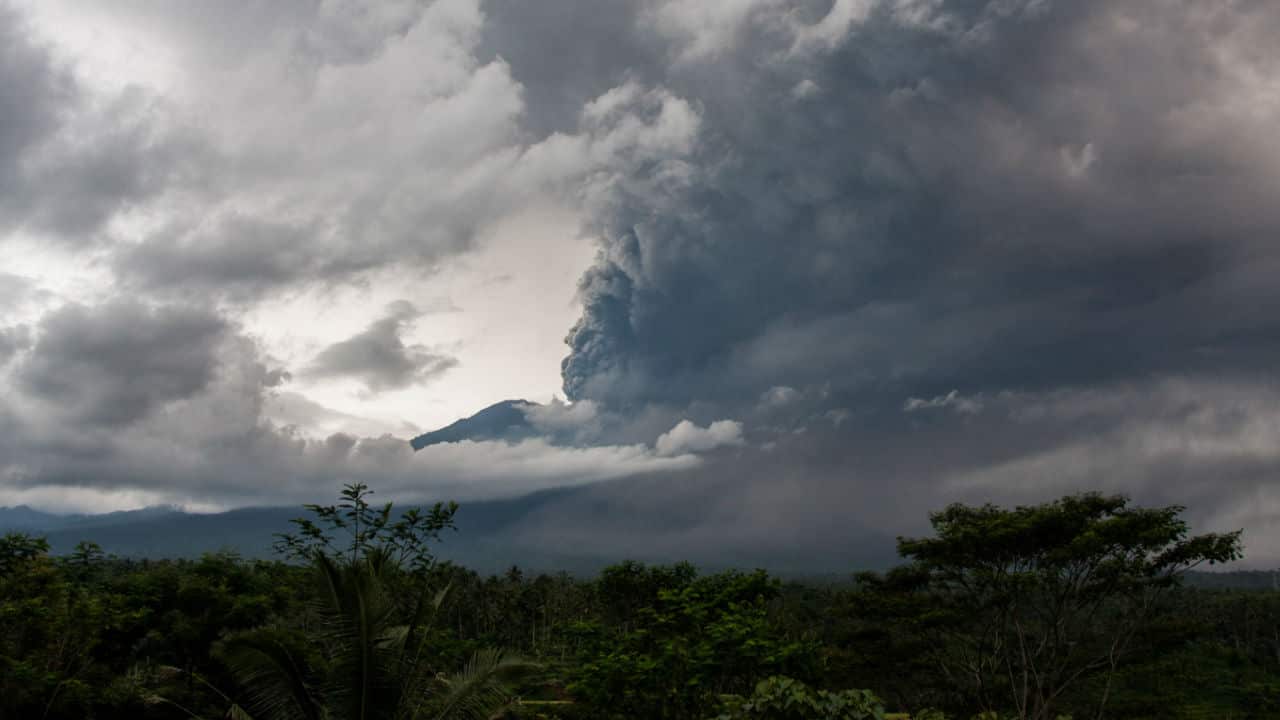 Thick clouds of smokes are seen from the Mount Agung volcano during an eruption in the district of Karangasem, Bali.
