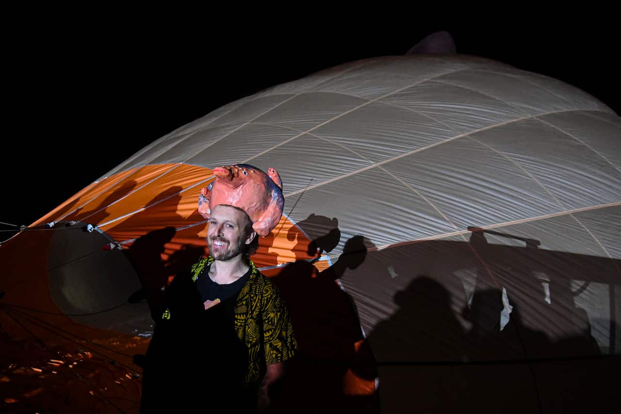 Thousands of Canberrans rose before dawn to see the official unveiling of Skywhalepapa.