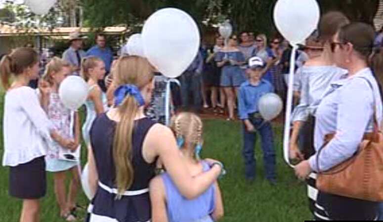 Friends and family release baloons in memory of Dolly.