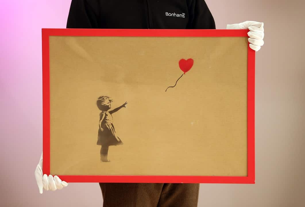 2012: Banksy's 'Girl and Balloon' which was painted on an Ikea frame at Bonhams auctioneers.