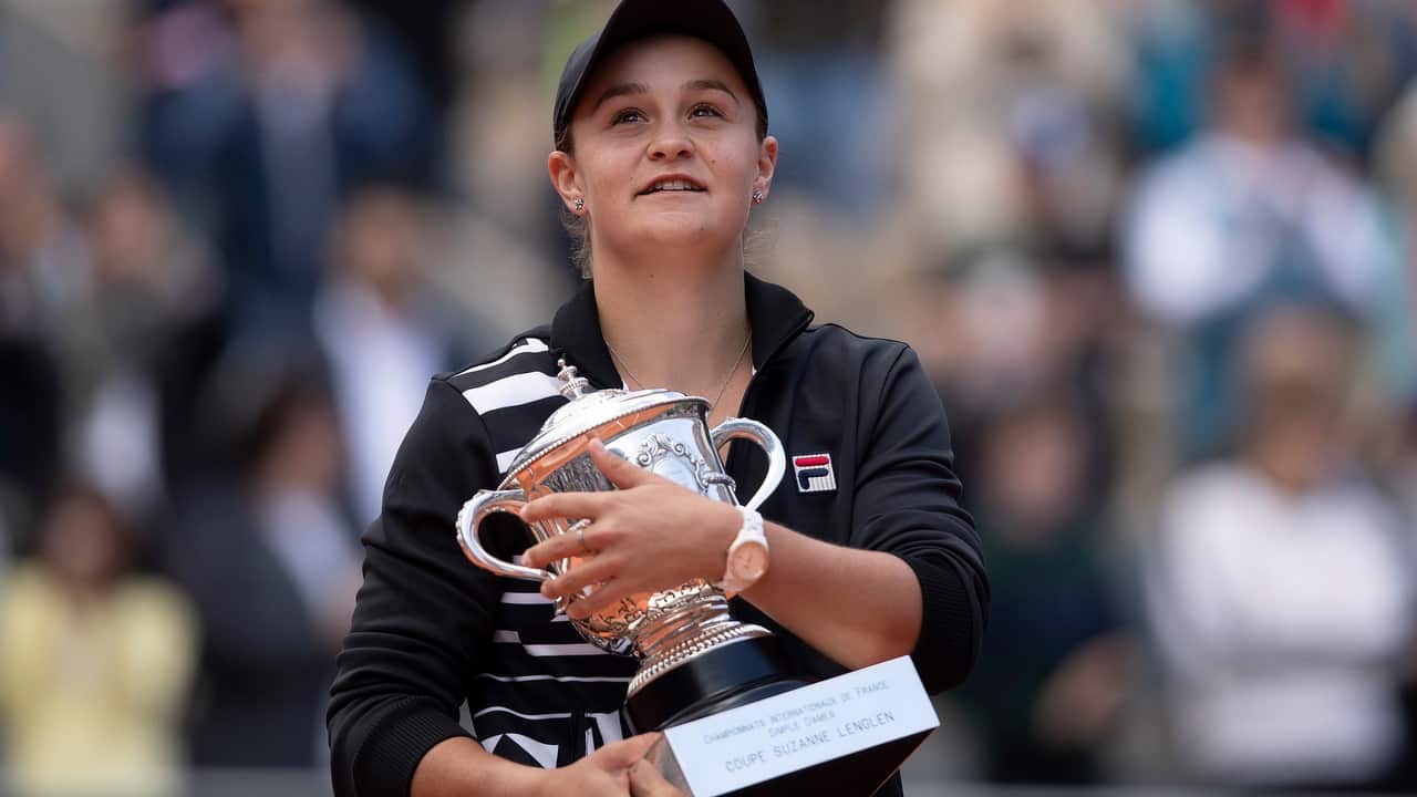 Ashleigh Barty holds the trophy after her match against Marketa Vondrousova.
