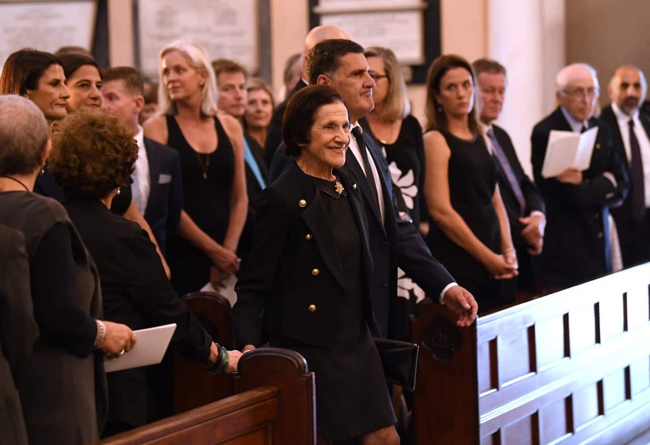 Former NSW governor Marie Bashir (centre) arrives to the state funeral of her late husband Sir Nicholas Michael Shehadie at St James' Church