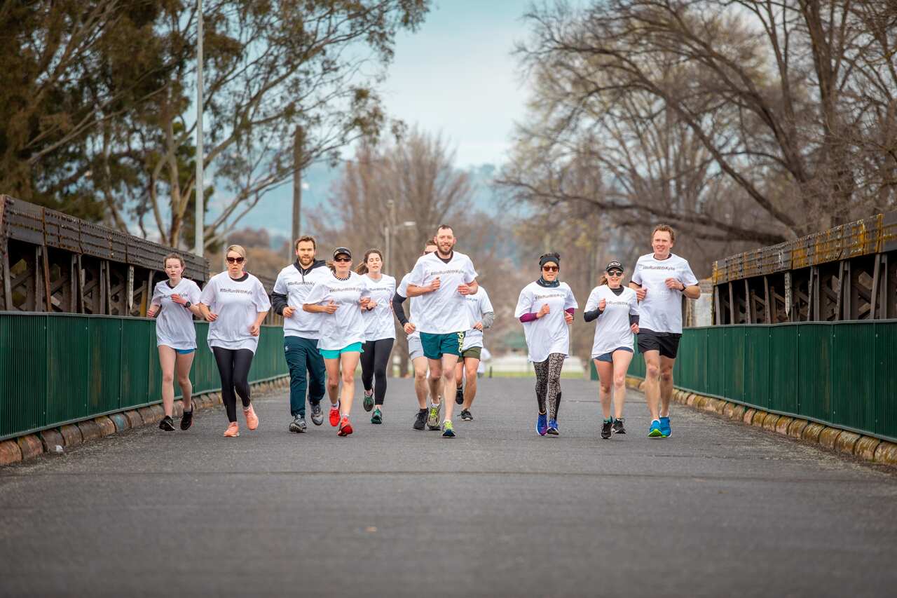 Kylie Gilbert-Moore supporters run in solidarity with her on Sunday in Bathurst.