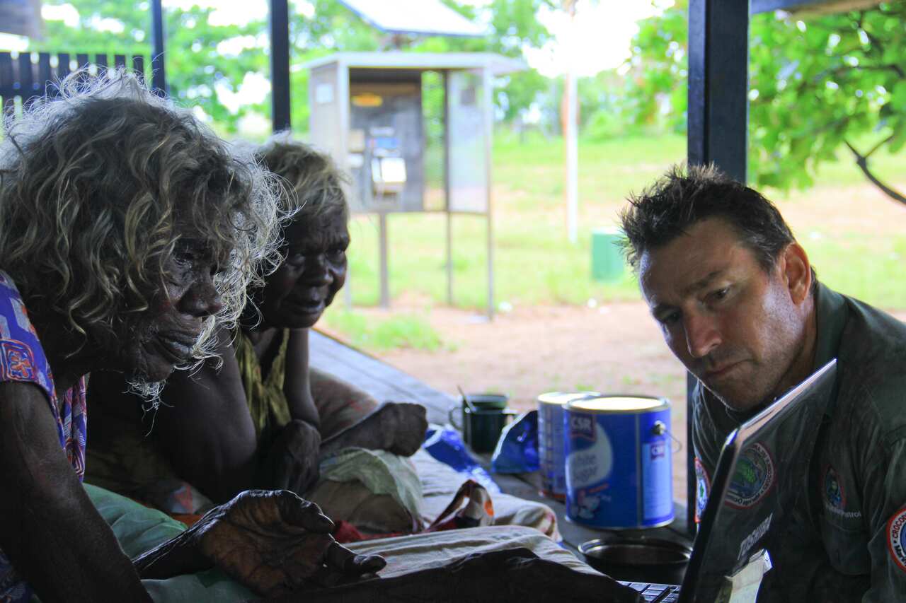 Dr James learning signs from Elders.