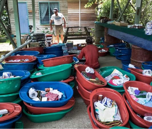 Barry Kirby packing Baby Bundles to deliver to new mothers in Papua New Guinea (supplied) 