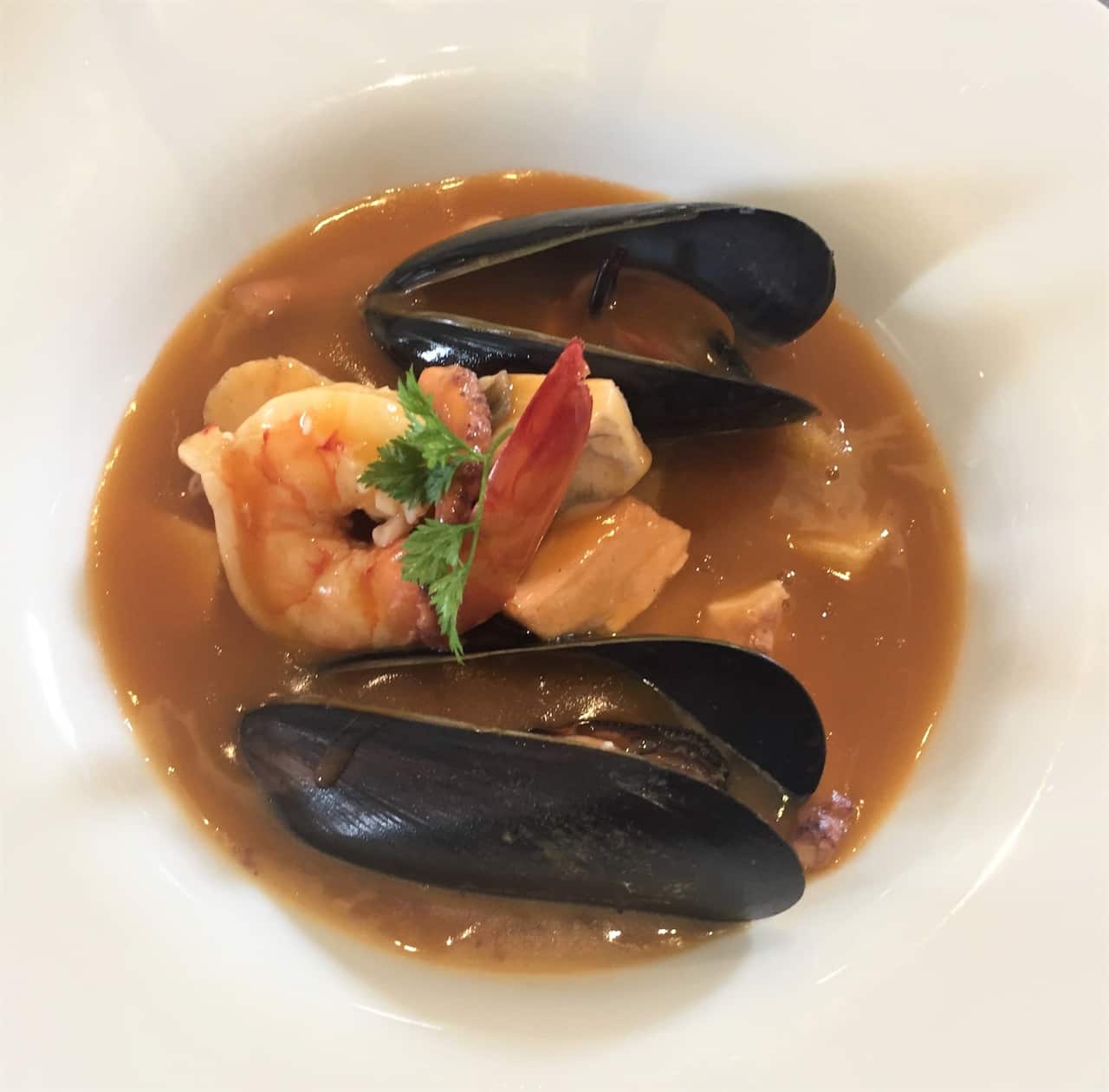 The restaurant's signature seafood soup bouillabaisse.