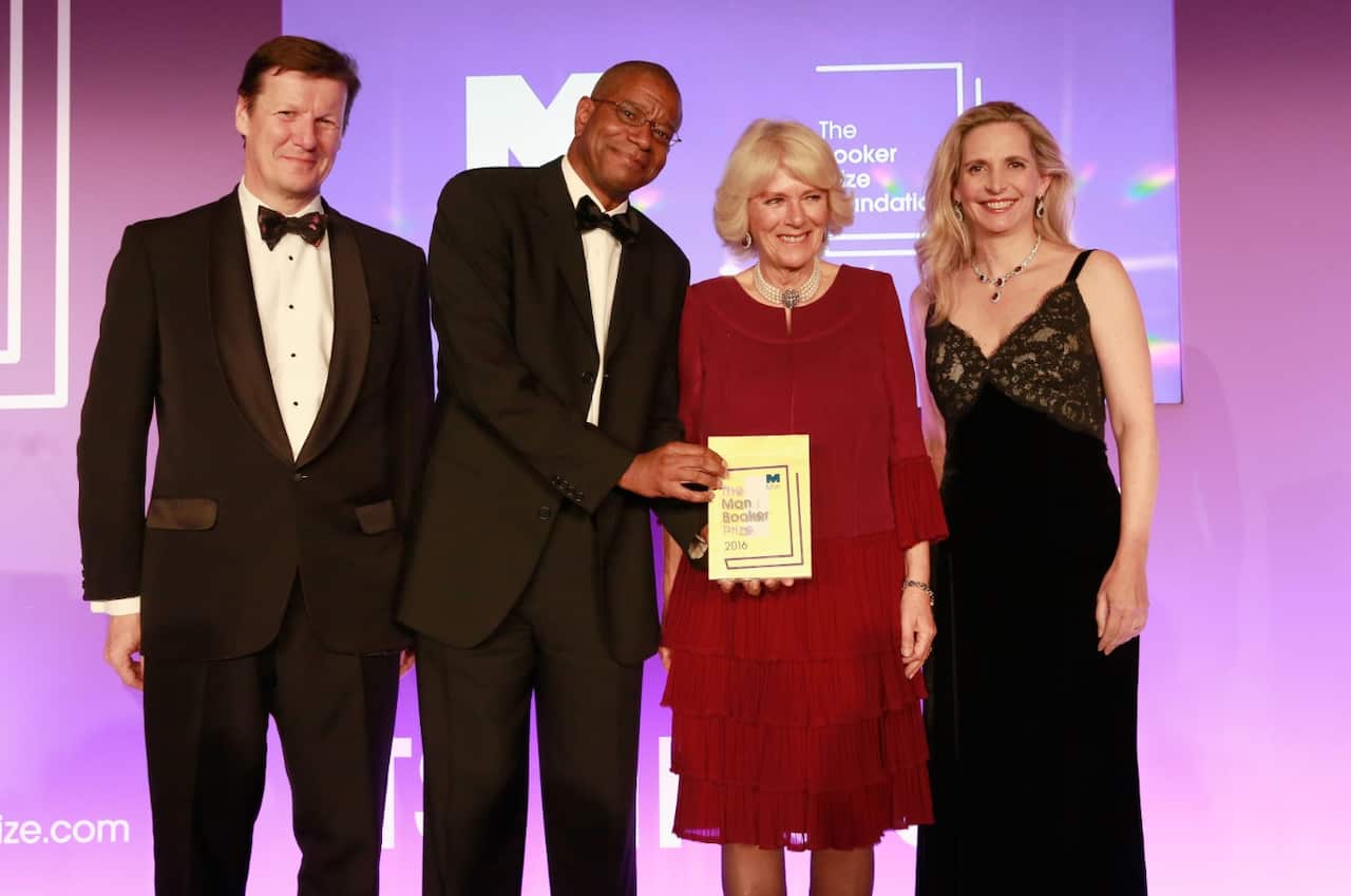The Duchess of Cornwall Duchess (red) with Paul Beatty, the winner of the 2016 Man Booker Prize