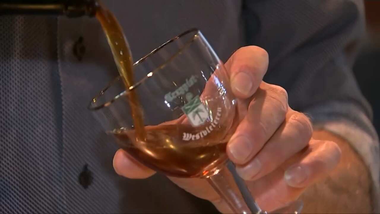 Trappist beer being poured into a glass