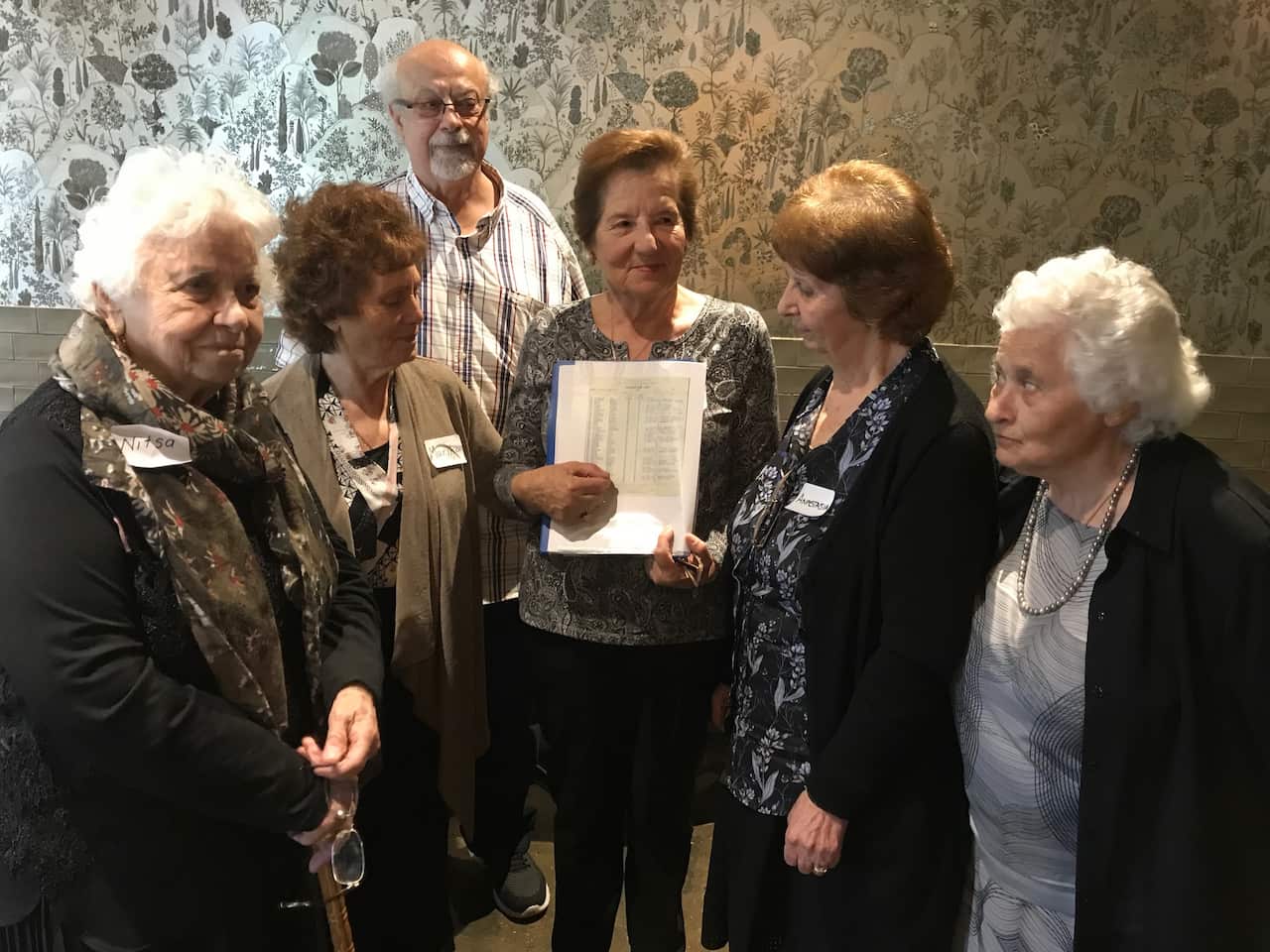Peter Photakis with some of the women who came to Australia on the Begona at a reunion in 2017.