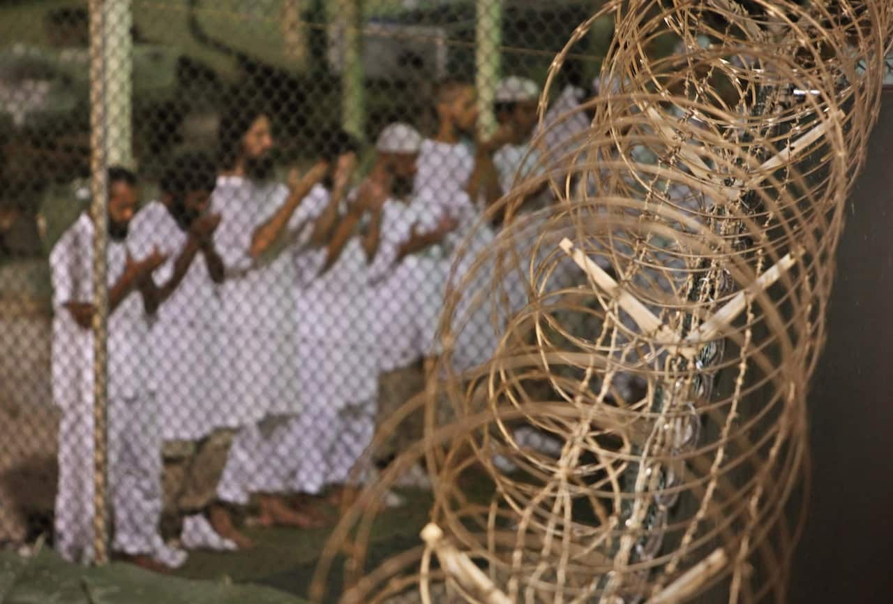 A file photo of detainees praying before dawn inside Camp 4 detention facility at Guantanamo Bay, Cuba.