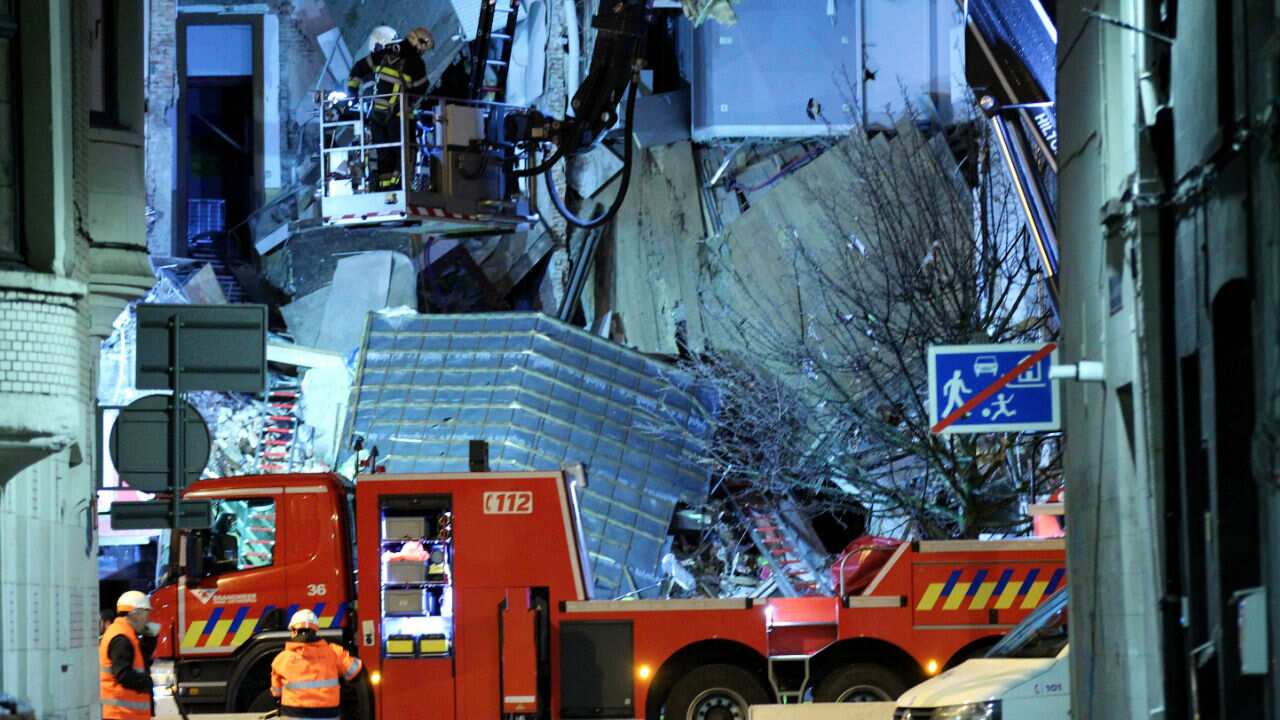 Firefighters and police officers arrive at the scene.