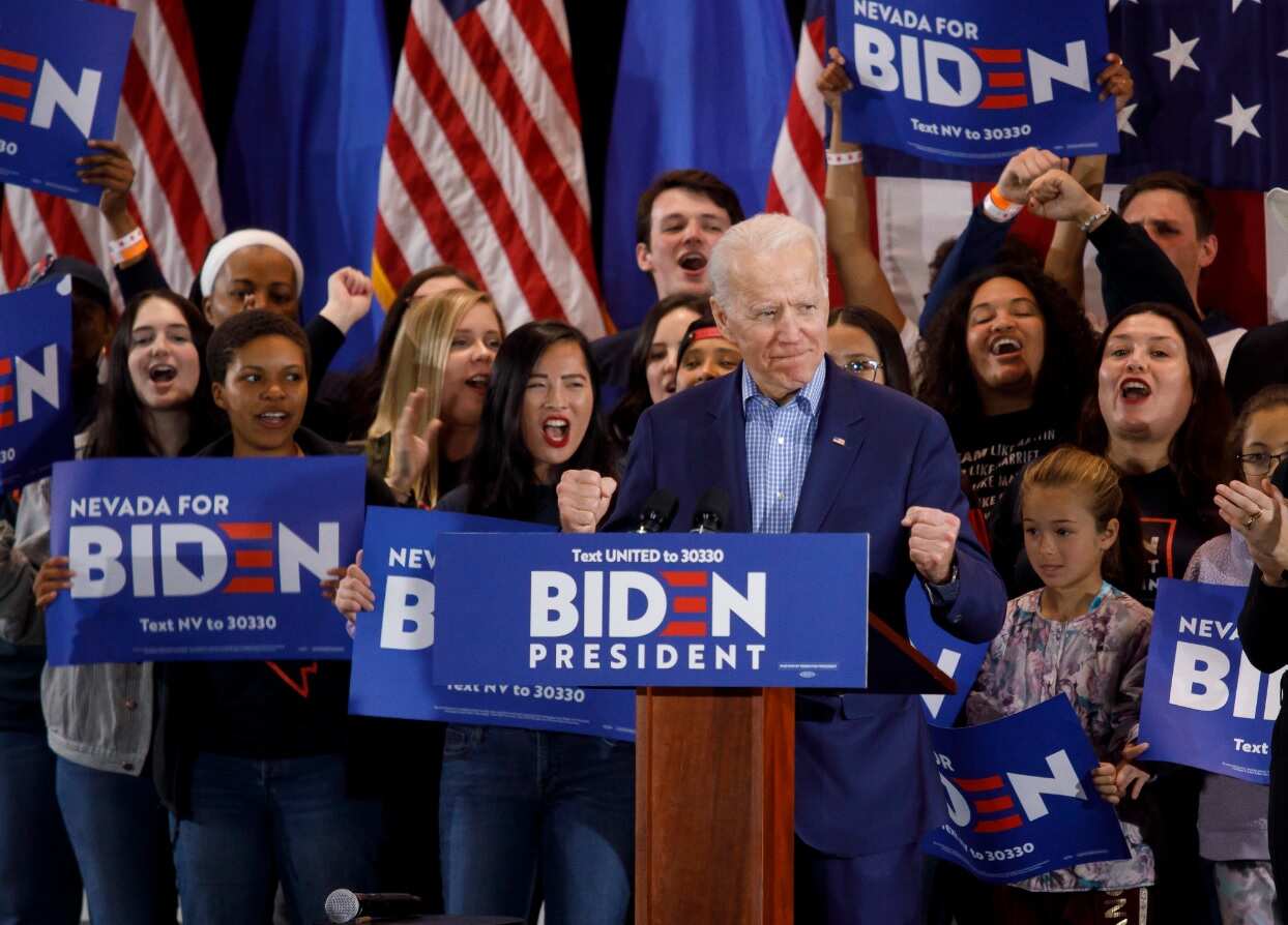 US Democratic presidential candidate, former Vice President Joe Biden (2-L), arrives on stage during his Nevada post-caucus rally in Las Vegas
