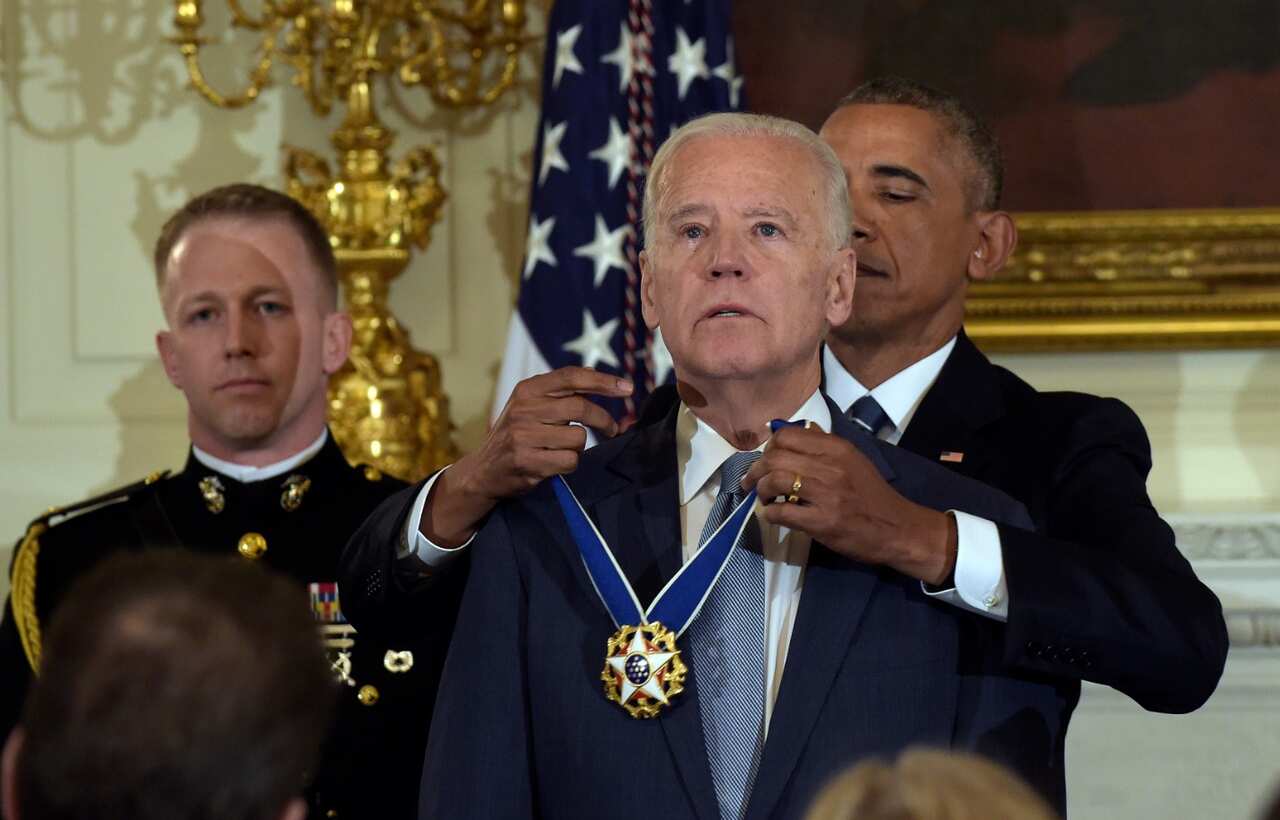 President Barack Obama presents Vice President Joe Biden with the Presidential Medal of Freedom during a ceremony in 2017