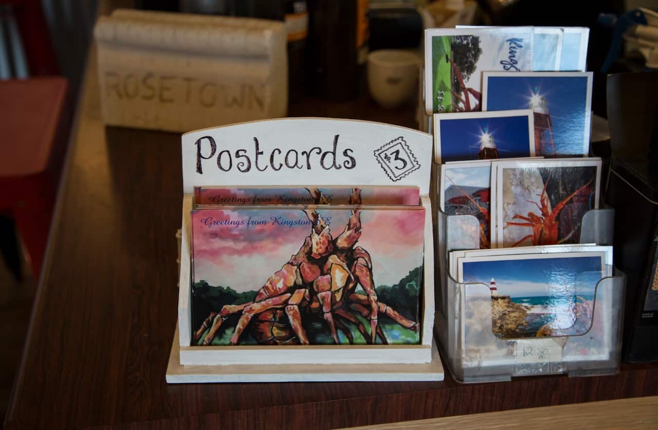 Postcards of Larry, known as The Big Lobster, at Robe Bakery Rosetown, a nearby cafe and bakery around the corner from the landmark