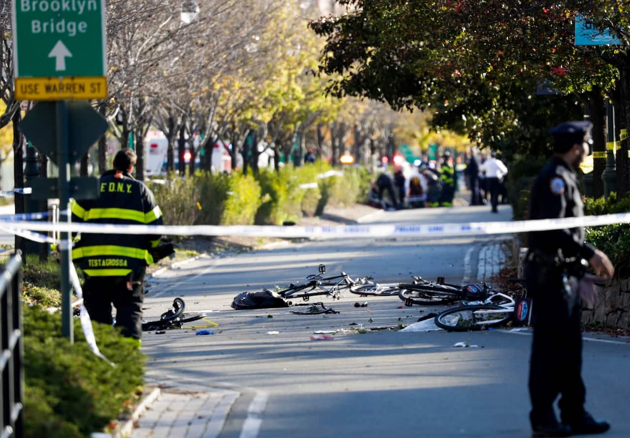 Bicycles and debris lie on a bike path after a motorist drove onto the path near the World Trade Center memorial (AAP)