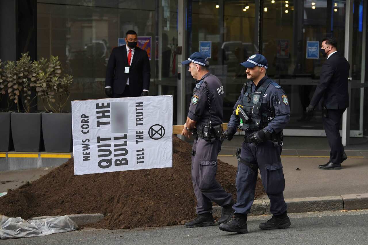 A pile of manure is dumped outside the News Corp Australia offices in Sydney, Friday, September, 4, 2020. 