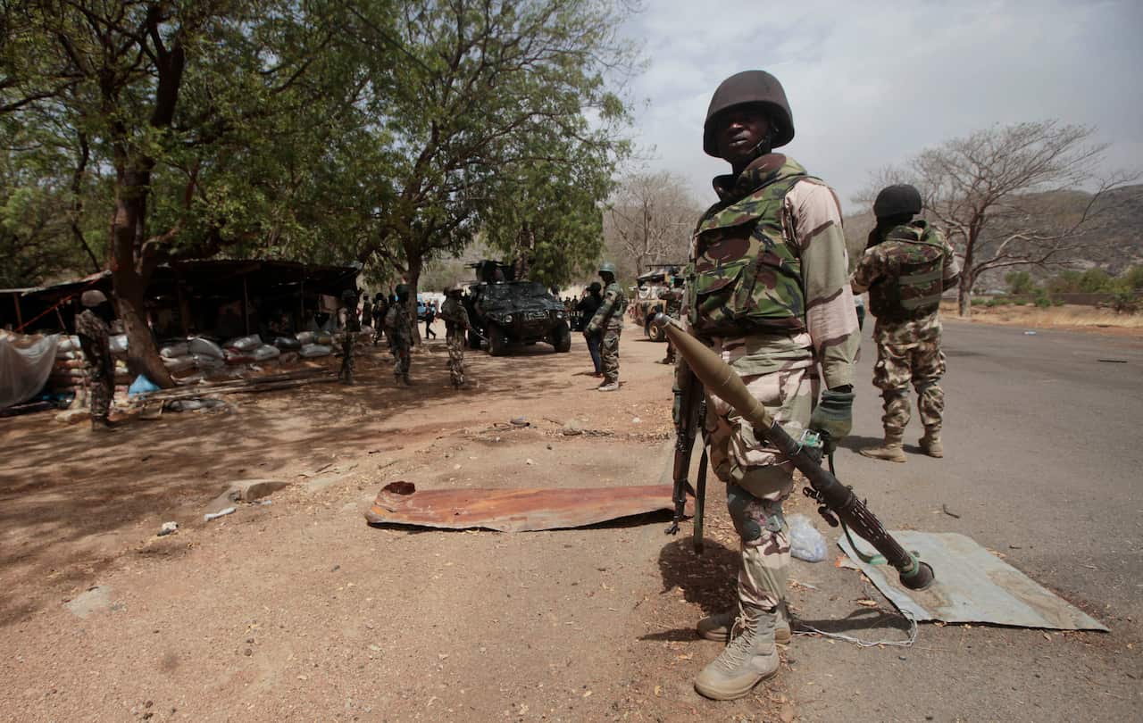 Nigerian soldiers man a checkpoint in Gwoza, Nigeria.